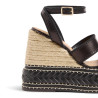 Sandalias Faure en piel, cierre lateral de pulsera con hebilla metálica.