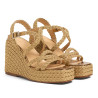 Sandalias Timotea en piel con trenzado metalizado, suela a tono.