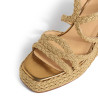 Sandalias Timotea en piel con trenzado metalizado, suela a tono.